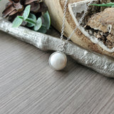 Pearl Necklace, Button
